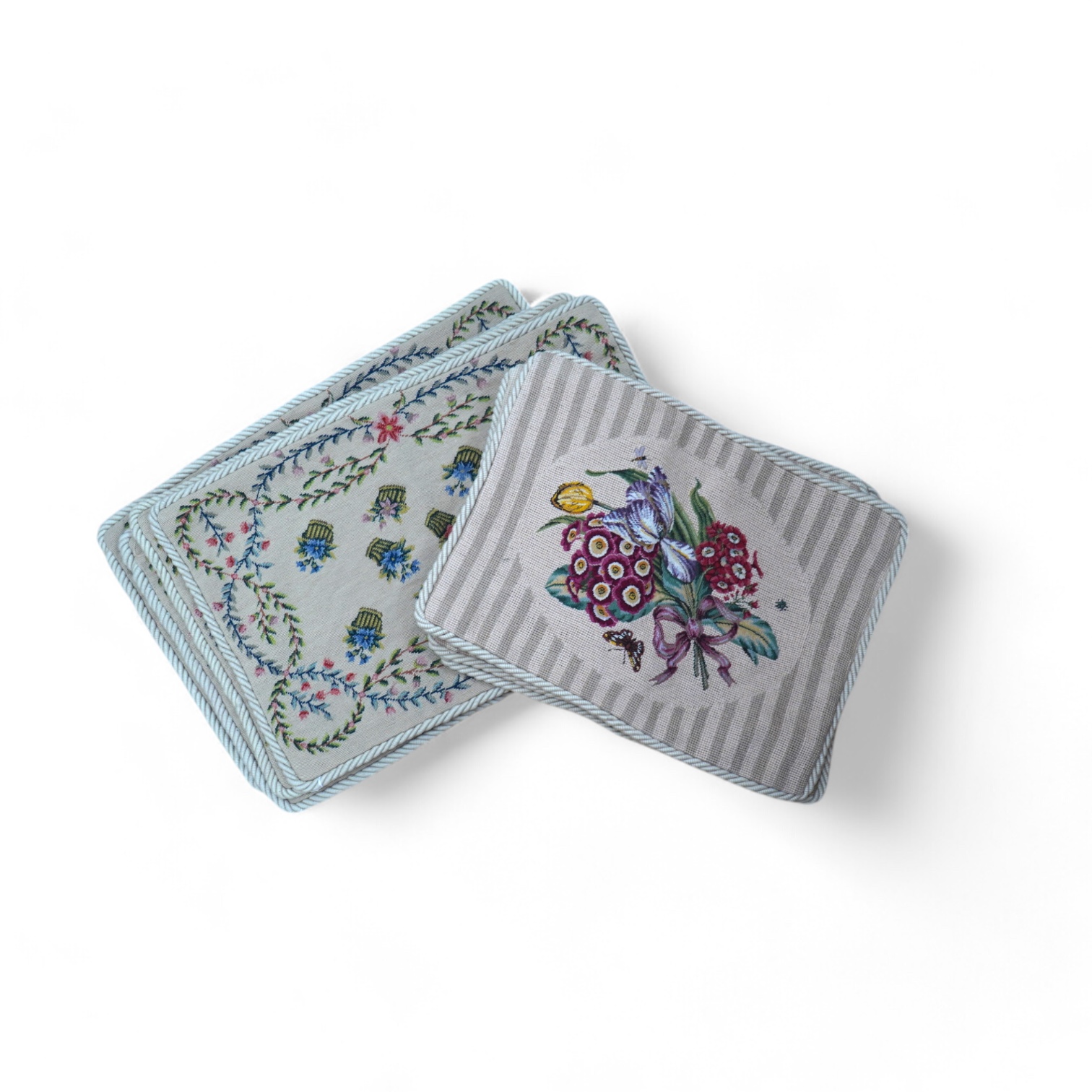 Four floral bouquet and butterfly wool work cushion covers and four similar basket of flowers sprig pattern cushions all edged with mushroom roping, basket sprig pattern 44cm wide, 34cm high. Condition - good